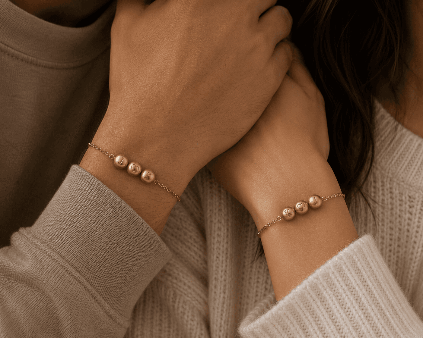 Two people wearing Lumheart beads together